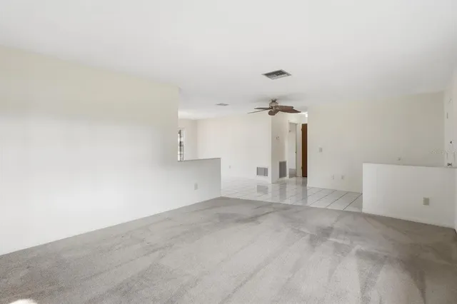 a view of a kitchen with a sink and cabinets
