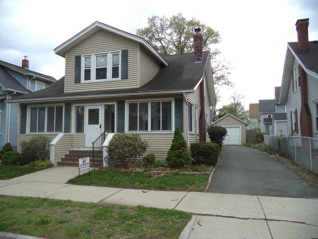 32 Freeman Terrace Springfield, MA 01104 - Photo 1 of 23 a front view of a house with garden