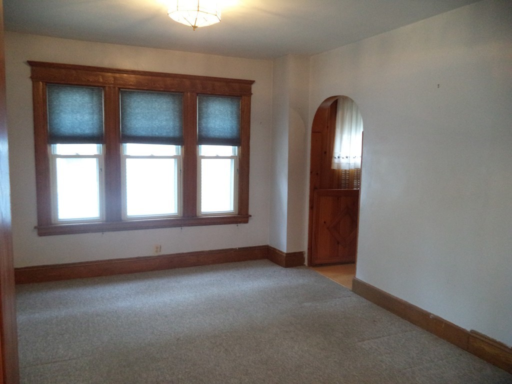 32 Freeman Terrace Springfield, MA 01104 - Photo 5 of 23 an empty room that has a window