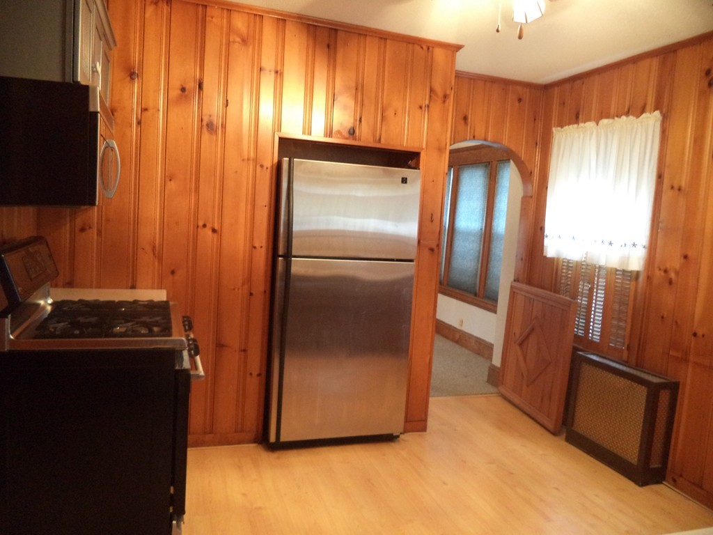 32 Freeman Terrace Springfield, MA 01104 - Photo 7 of 23 a kitchen with metallic refrigerator freezer and a dishwasher