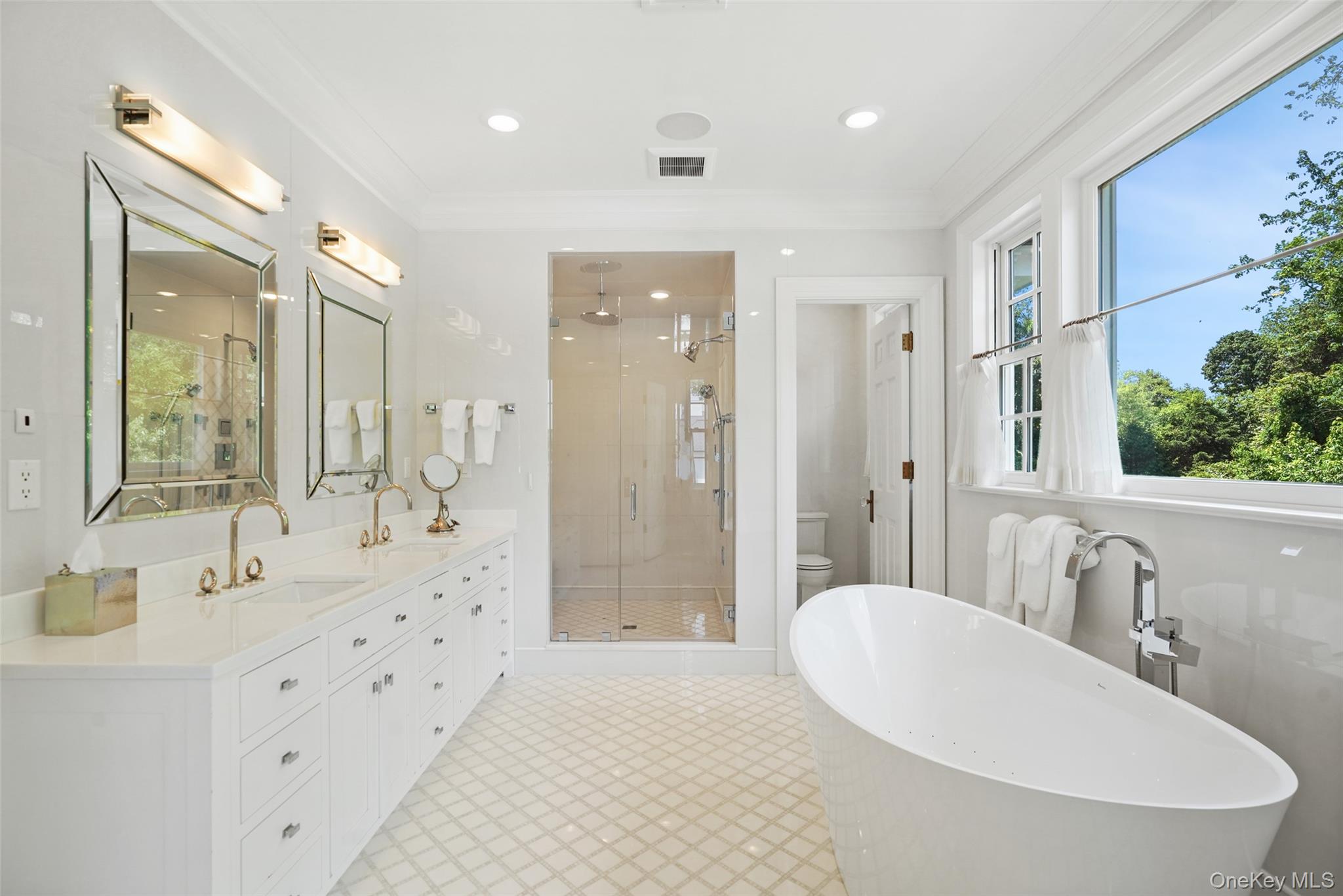 27 Murray Hill Road Scarsdale, NY 10583 - Photo 5 of 29 a bathroom with a double vanity sink mirror and shower