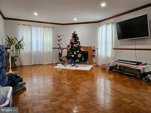 a living room with fireplace furniture and a flat screen tv