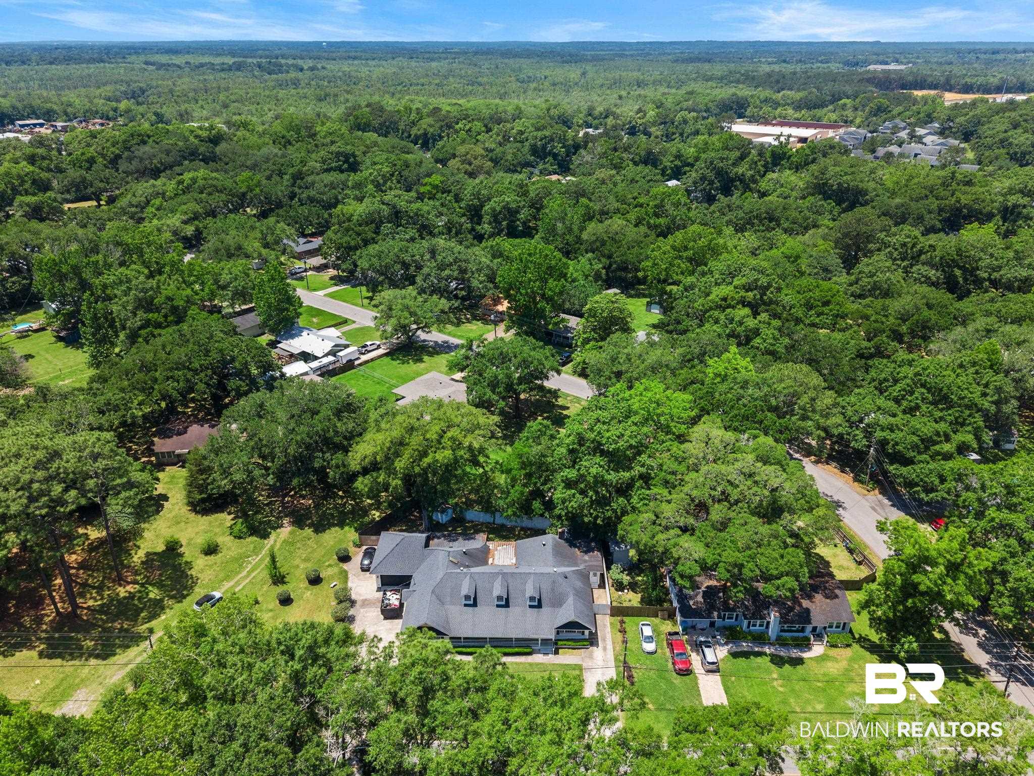 927 Cleveland Road Saraland, AL 36571 - Photo 70 of 80 Aerial perspective showcasing a residential property with an expansive treed landscape