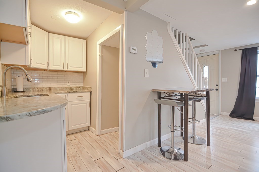 8 Maple Avenue Danvers, MA 01923 - Photo 12 of 42 a kitchen with a refrigerator a sink and cabinets