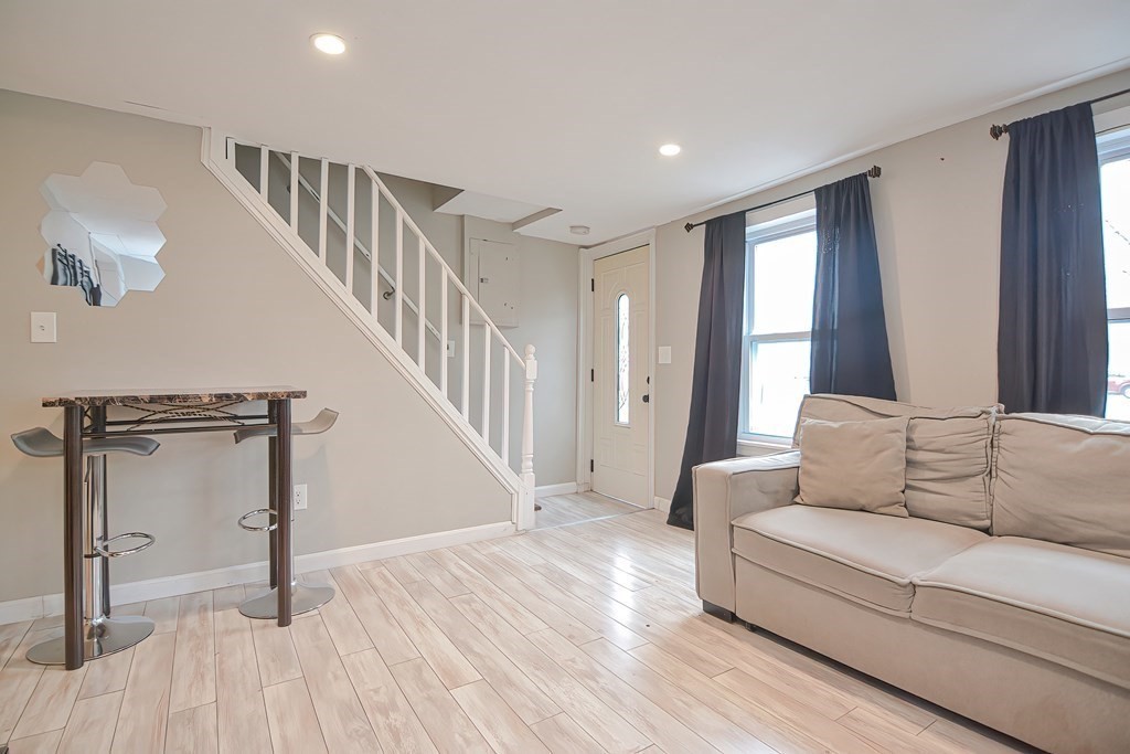 8 Maple Avenue Danvers, MA 01923 - Photo 13 of 42 a living room with furniture and a hard wood floor