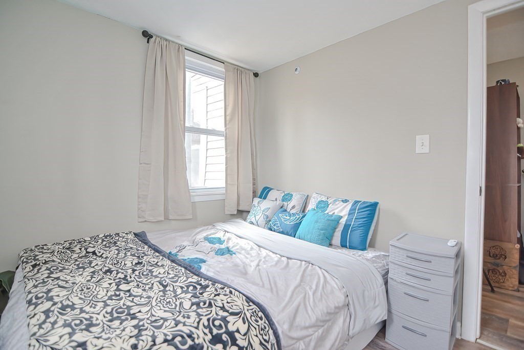 8 Maple Avenue Danvers, MA 01923 - Photo 15 of 42 a bedroom with a bed and a window