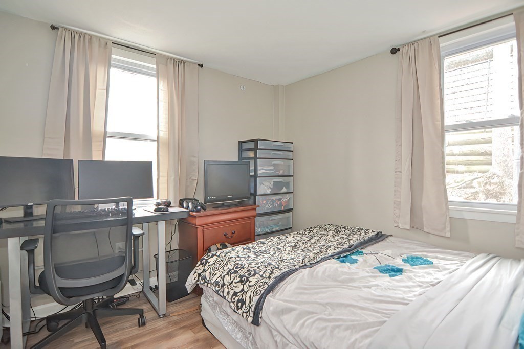 8 Maple Avenue Danvers, MA 01923 - Photo 16 of 42 a bedroom with a bed and furniture