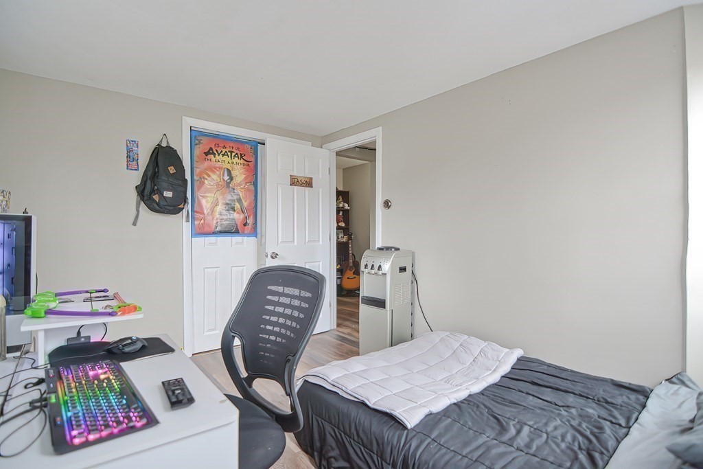 8 Maple Avenue Danvers, MA 01923 - Photo 18 of 42 a bedroom with furniture and a chair