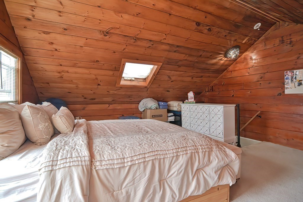 8 Maple Avenue Danvers, MA 01923 - Photo 19 of 42 a bedroom with a bed and wooden floor