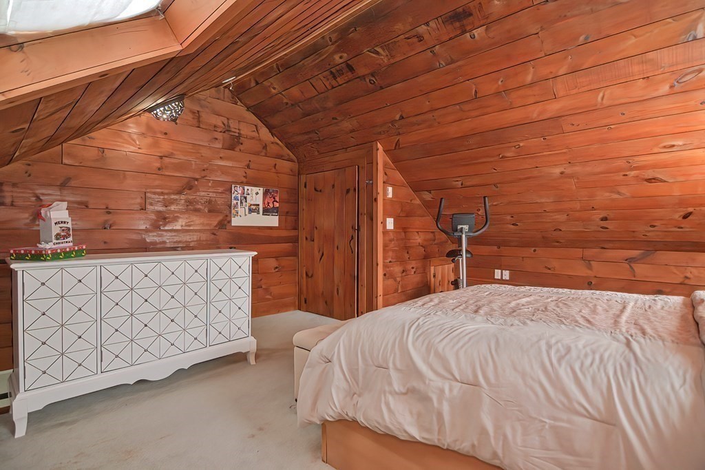 8 Maple Avenue Danvers, MA 01923 - Photo 20 of 42 a bedroom with a bed and a night stand