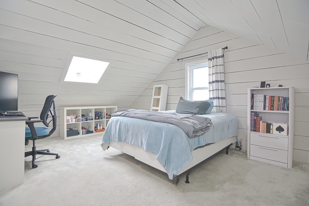 8 Maple Avenue Danvers, MA 01923 - Photo 24 of 42 a bedroom with a bed a desk and chair