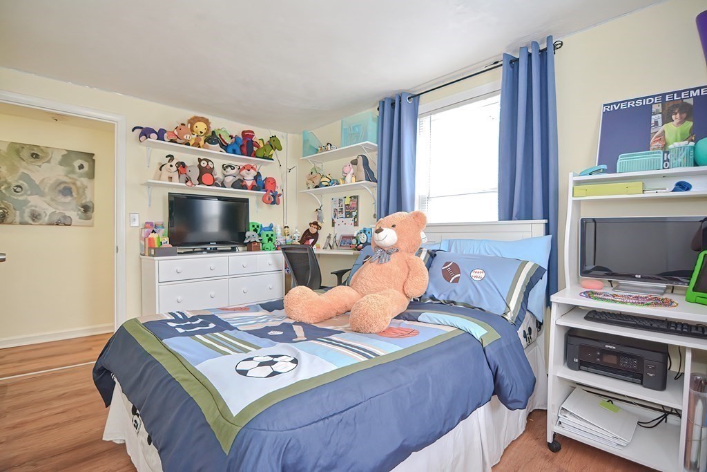 8 Maple Avenue Danvers, MA 01923 - Photo 25 of 42 a bedroom with a bed and a tv