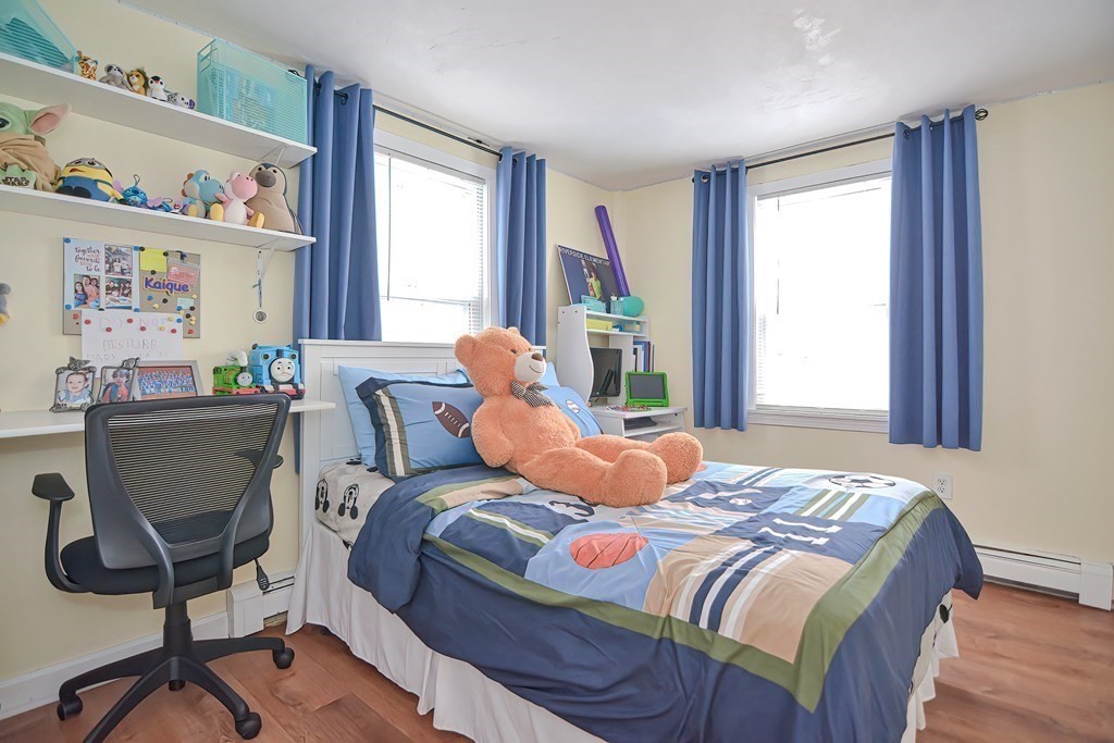 8 Maple Avenue Danvers, MA 01923 - Photo 26 of 42 a bedroom with a bed and a window