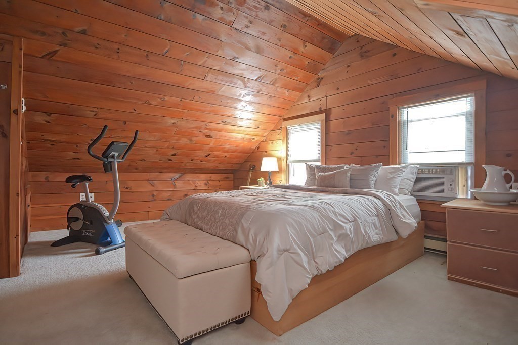 8 Maple Avenue Danvers, MA 01923 - Photo 29 of 42 a bedroom with a bed and a couch