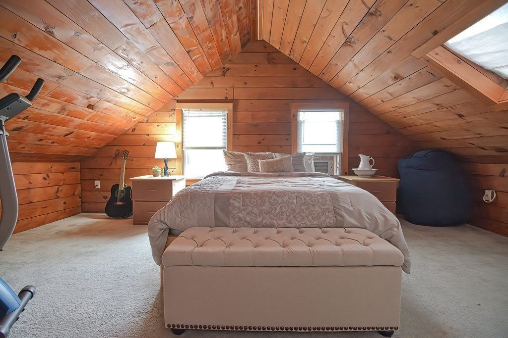 8 Maple Avenue Danvers, MA 01923 - Photo 30 of 42 a bed sitting in a spacious bedroom next to a window