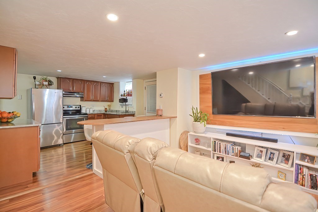 8 Maple Avenue Danvers, MA 01923 - Photo 7 of 42 a living room with stainless steel appliances furniture and a kitchen view