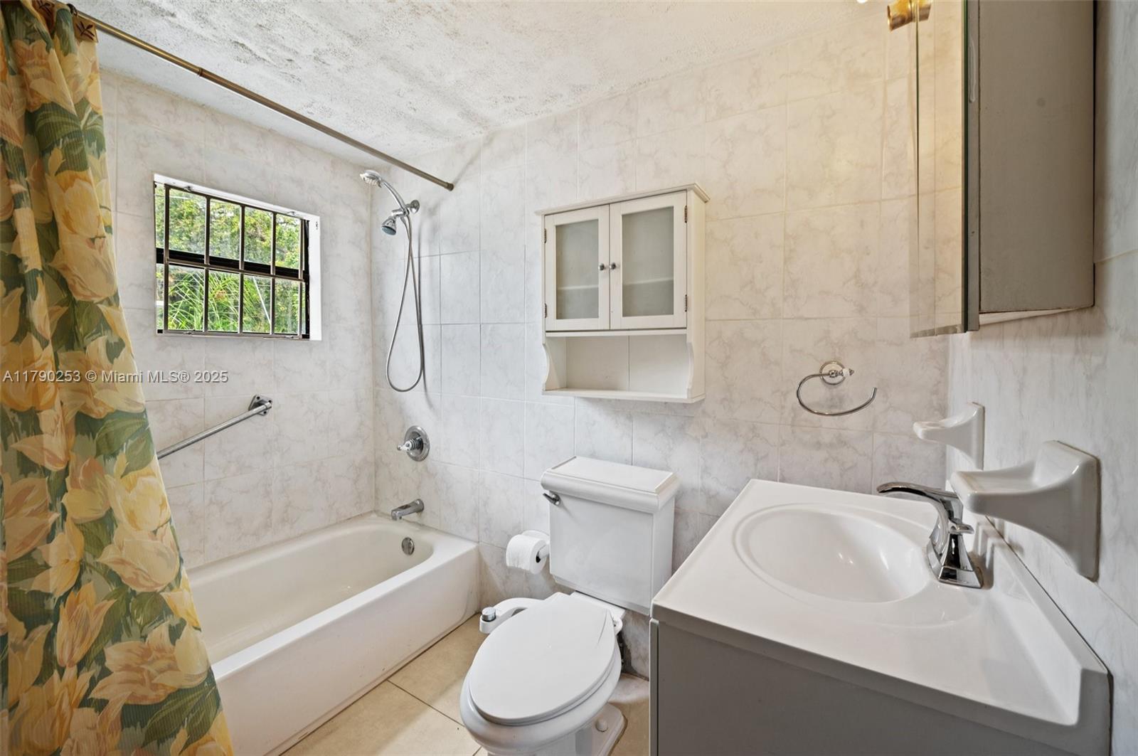 5731 Simms Street Hollywood, FL 33021 - Photo 18 of 33 a bathroom with a sink toilet and shower