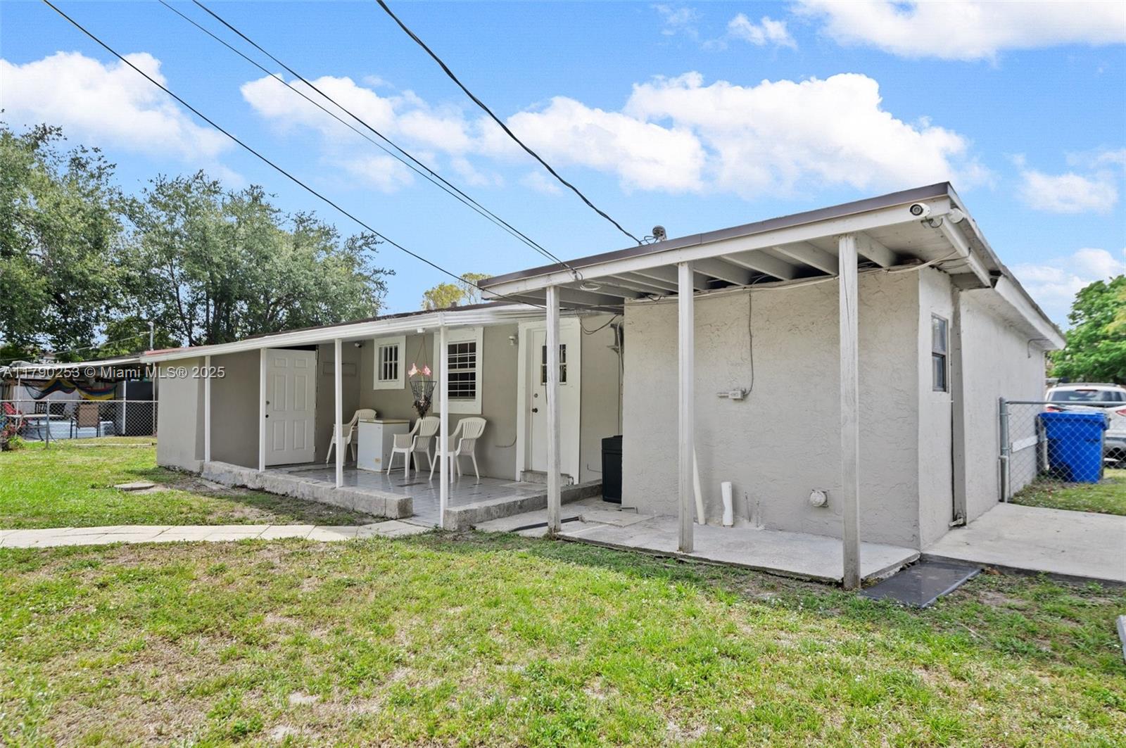 5731 Simms Street Hollywood, FL 33021 - Photo 24 of 33 a front view of a house with garden