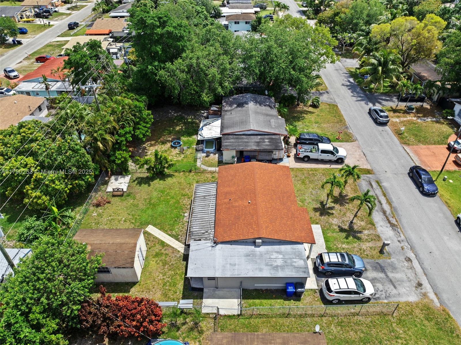 5731 Simms Street Hollywood, FL 33021 - Photo 25 of 33 an aerial view of a house with a garden and swimming pool