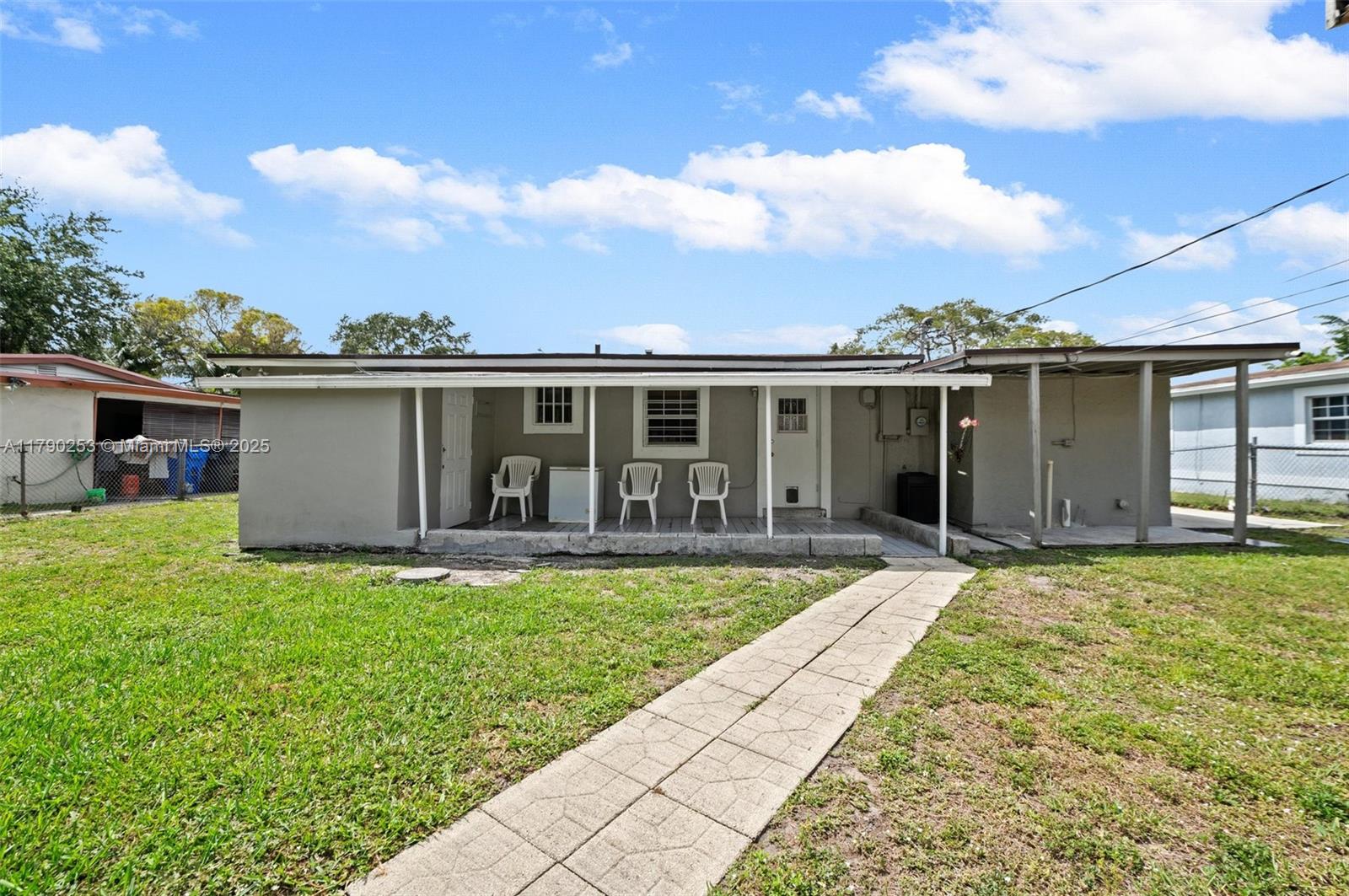 5731 Simms Street Hollywood, FL 33021 - Photo 28 of 33 front view of a house with a yard