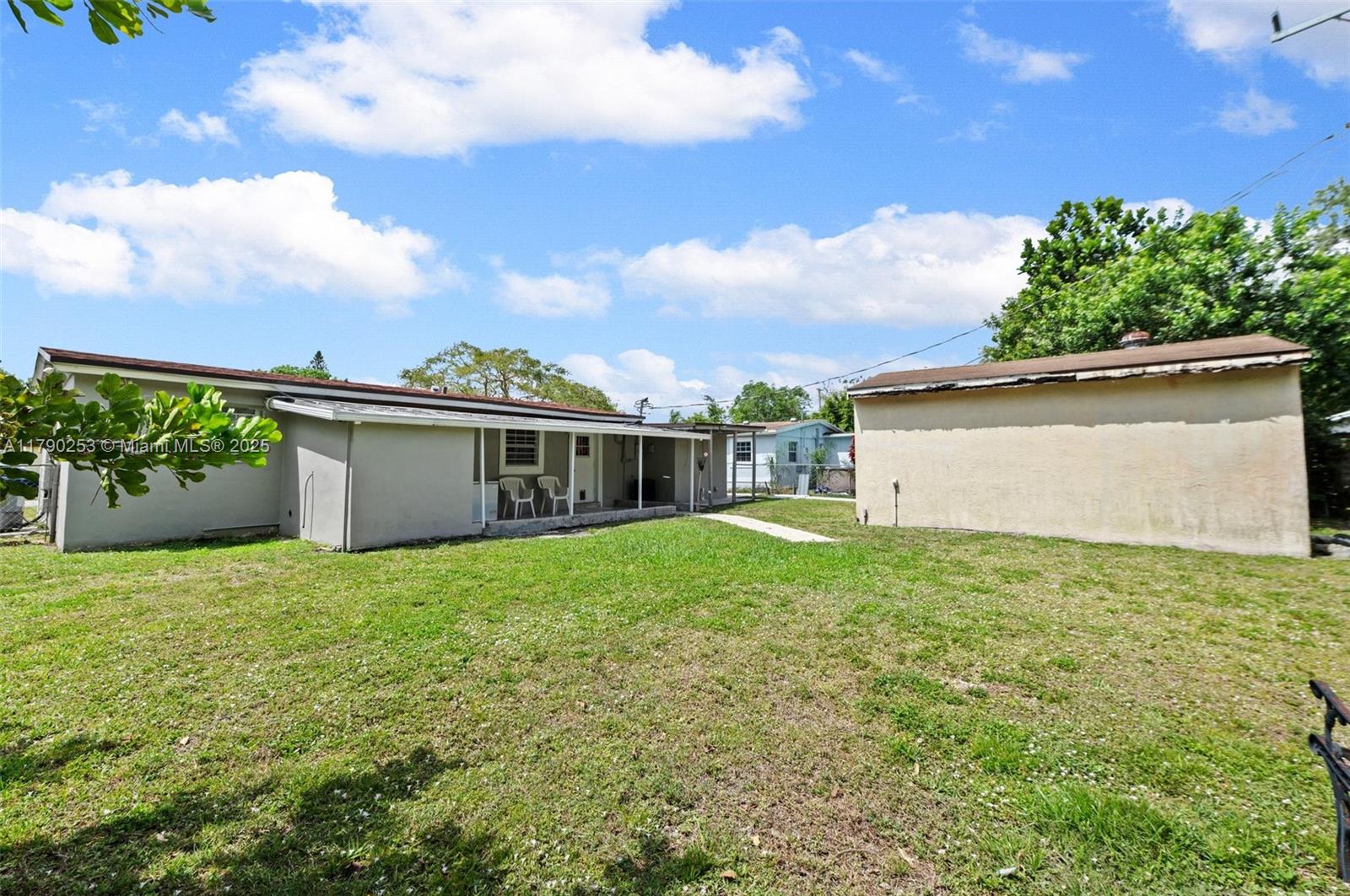 5731 Simms Street Hollywood, FL 33021 - Photo 29 of 33 a view of a house with backyard and garden