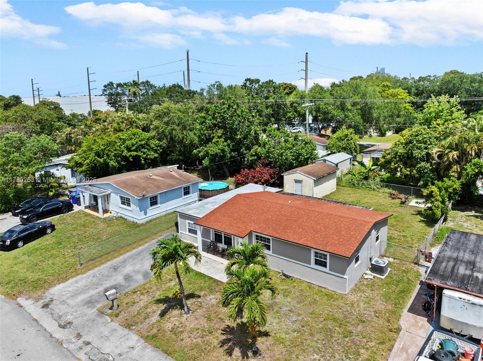 5731 Simms Street Hollywood, FL 33021 - Photo 3 of 33 an aerial view of a house with garden space and street view
