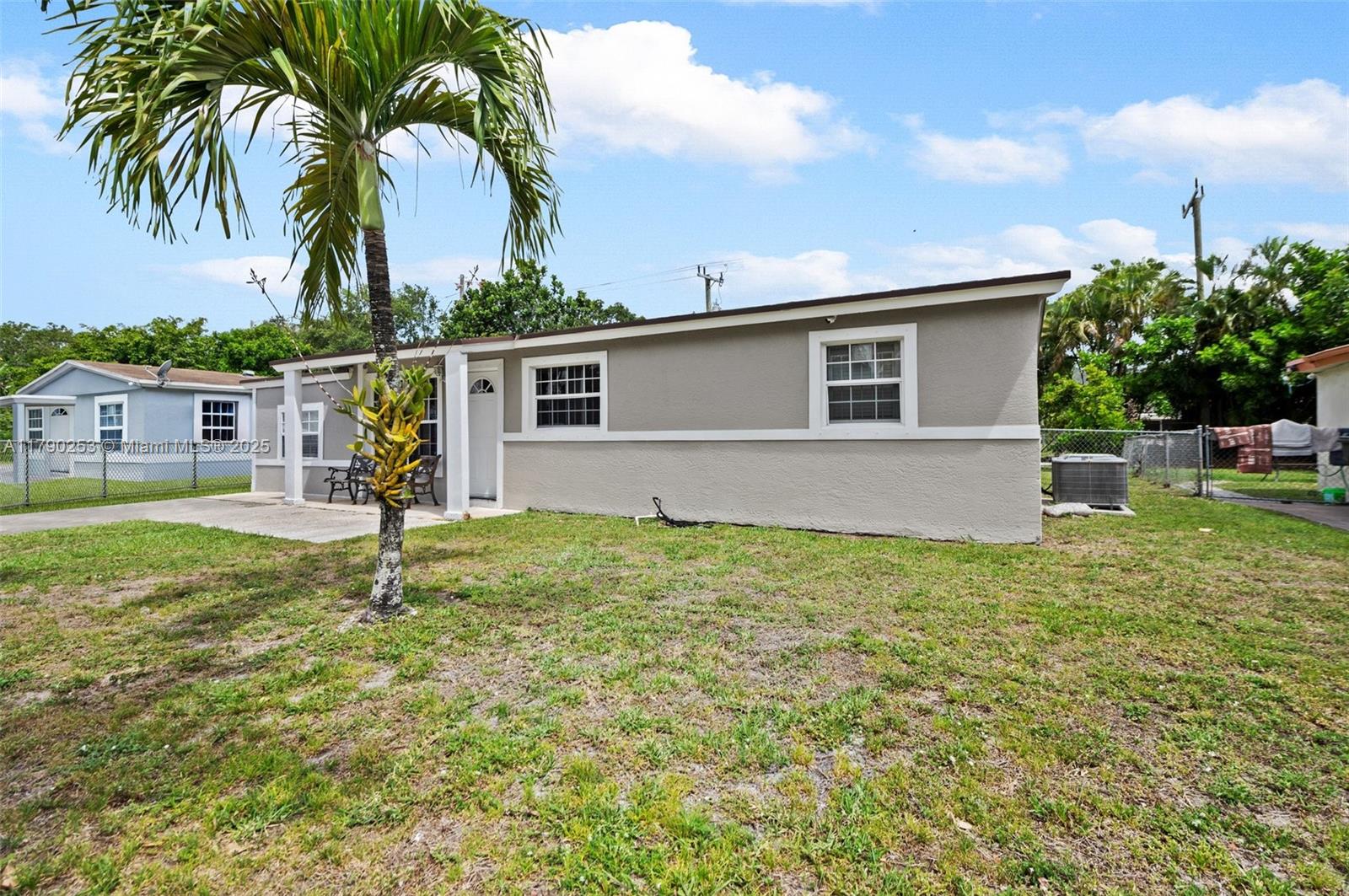 5731 Simms Street Hollywood, FL 33021 - Photo 4 of 33 a house view with a garden space