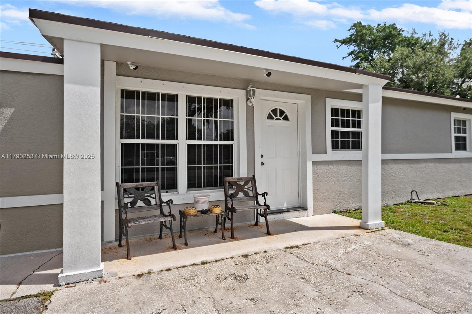 5731 Simms Street Hollywood, FL 33021 - Photo 5 of 33 a view of a entryway door and chair