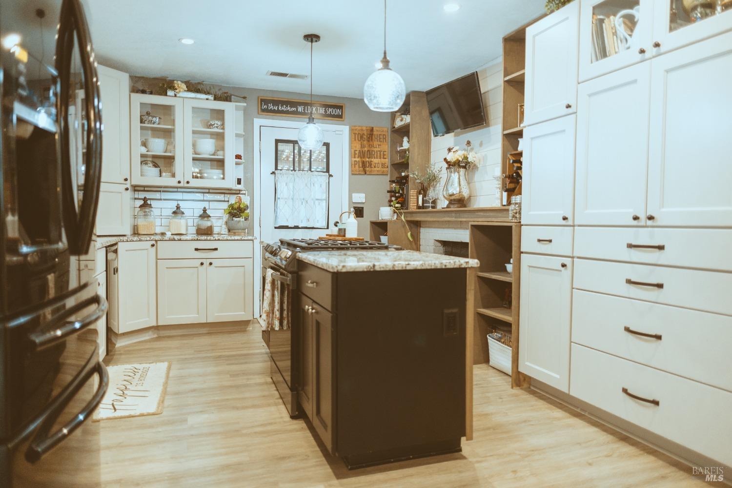 Undisclosed Address Rohnert Park, CA 94928 - Photo 11 of 38 a kitchen with cabinets a sink and appliances