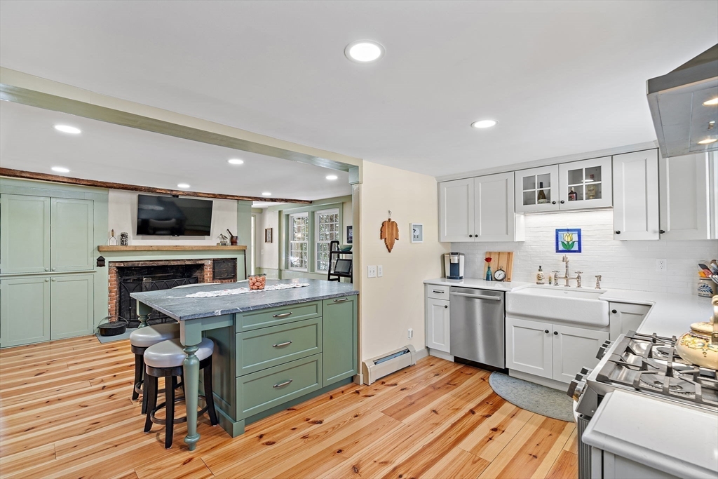 228 Main Street Groton, MA 01450 - Photo 13 of 33 a kitchen with a sink appliances and cabinets
