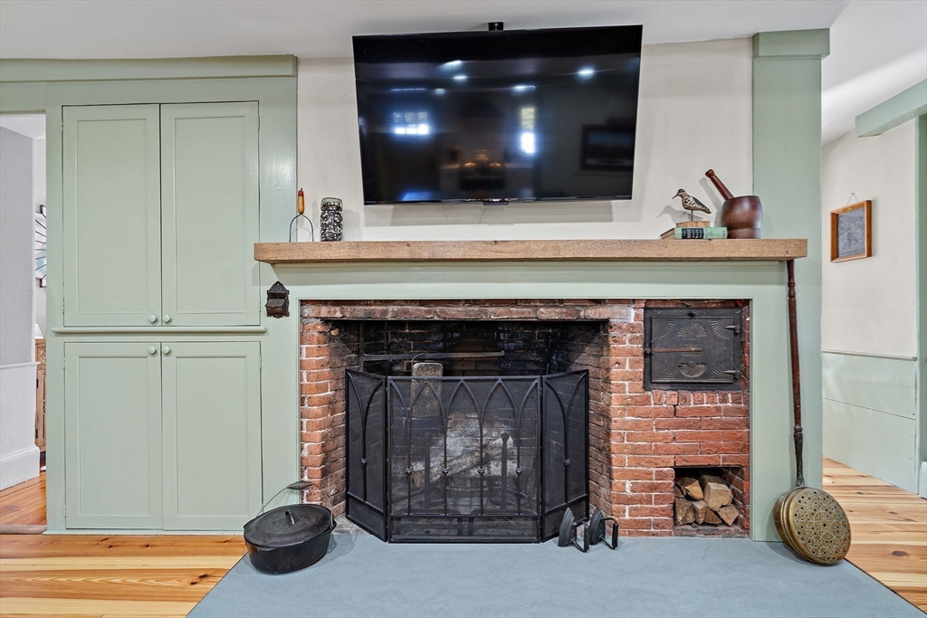 228 Main Street Groton, MA 01450 - Photo 14 of 33 a living room with furniture and a fireplace