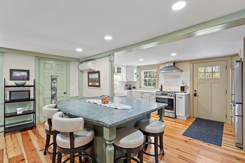 228 Main Street Groton, MA 01450 - Photo 16 of 33 a view of a dining room with furniture and wooden floor