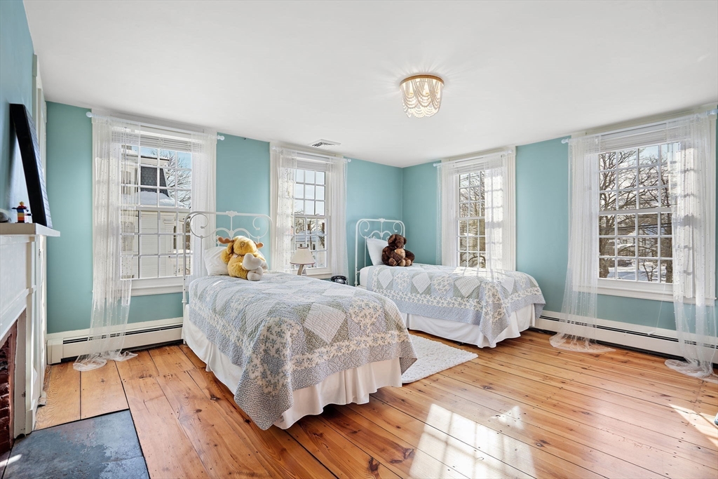 228 Main Street Groton, MA 01450 - Photo 21 of 33 a bedroom with two beds and a window