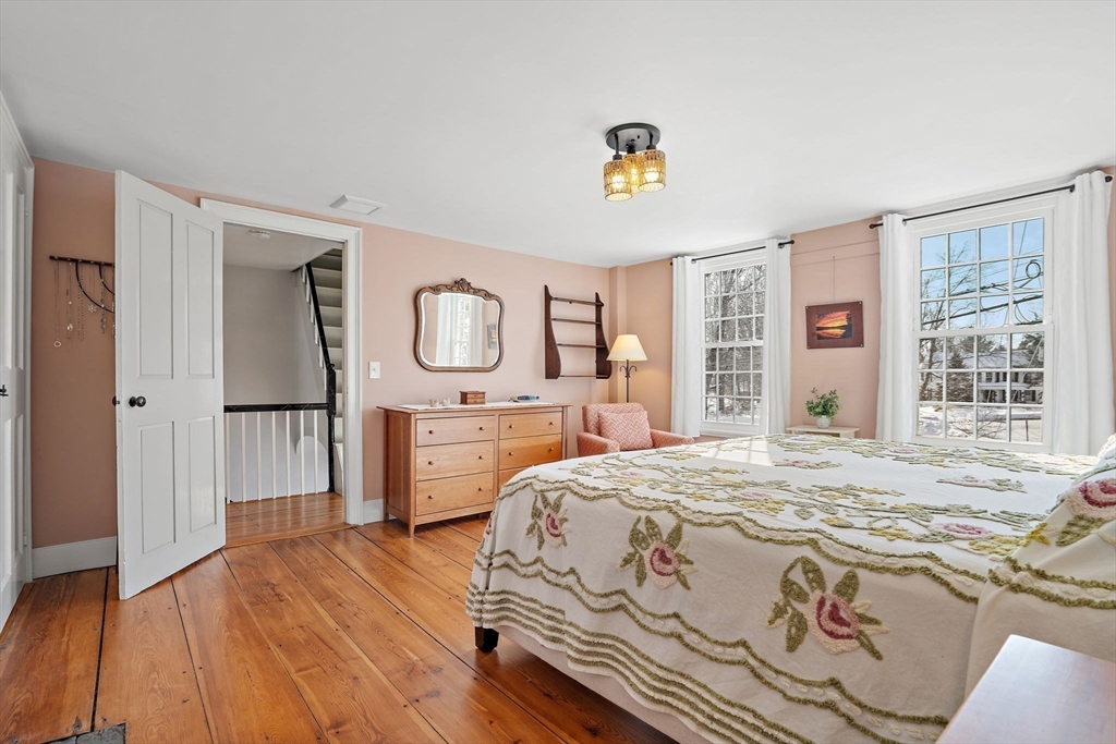 228 Main Street Groton, MA 01450 - Photo 23 of 33 a bedroom with a bed and a dresser