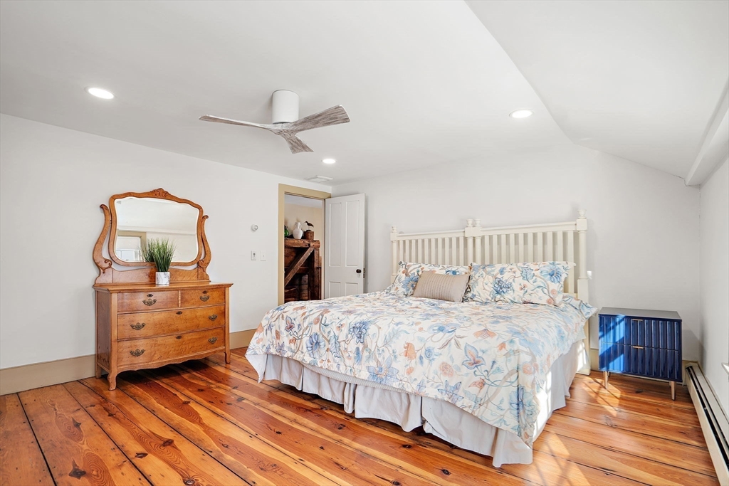 228 Main Street Groton, MA 01450 - Photo 24 of 33 a bedroom with a bed and a dresser