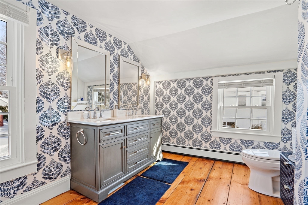 228 Main Street Groton, MA 01450 - Photo 28 of 33 a bathroom with a sink a vanity and a mirror