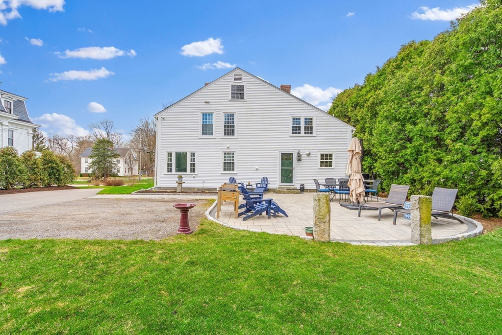 228 Main Street Groton, MA 01450 - Photo 30 of 33 a view of a house with backyard and sitting area