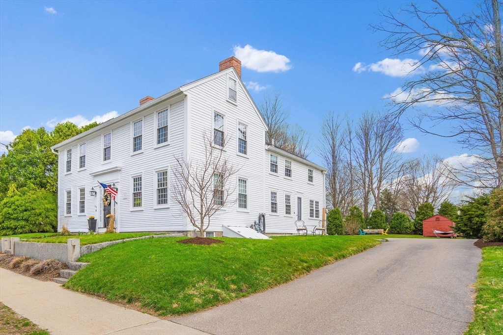 228 Main Street Groton, MA 01450 - Photo 31 of 33 a view of a white building with a yard