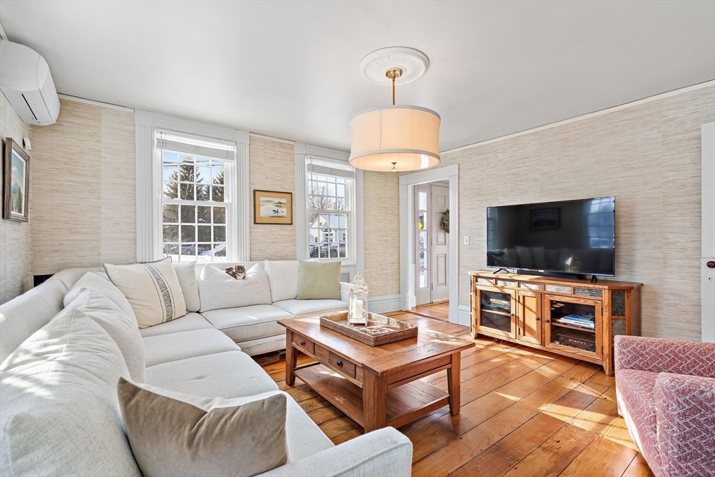 228 Main Street Groton, MA 01450 - Photo 4 of 33 a living room with furniture and a flat screen tv