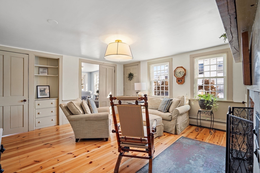 228 Main Street Groton, MA 01450 - Photo 10 of 33 a living room with furniture and a wooden floor