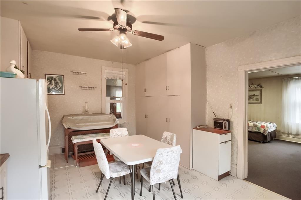 890 Old State Road Apollo, PA 15613 - Photo 11 of 25 a view of a dining room with furniture and a chandelier fan