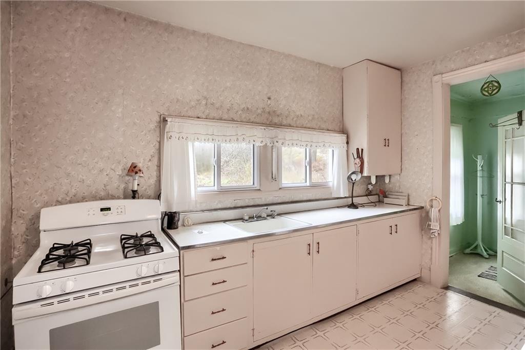 890 Old State Road Apollo, PA 15613 - Photo 13 of 25 a kitchen with sink a stove and cabinets