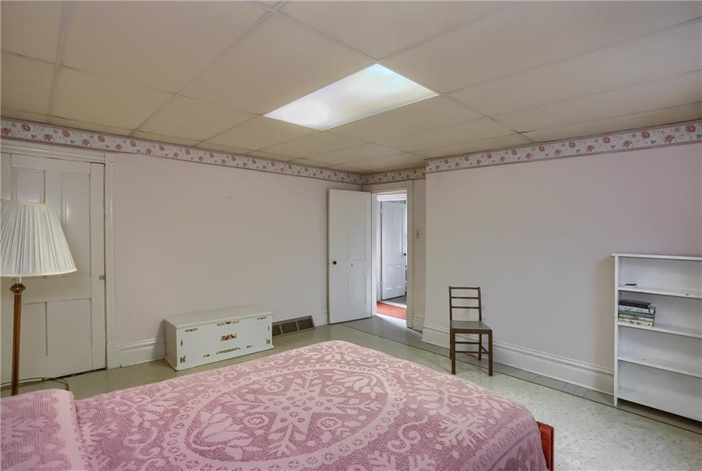 890 Old State Road Apollo, PA 15613 - Photo 18 of 25 a bedroom with a bed and a chair