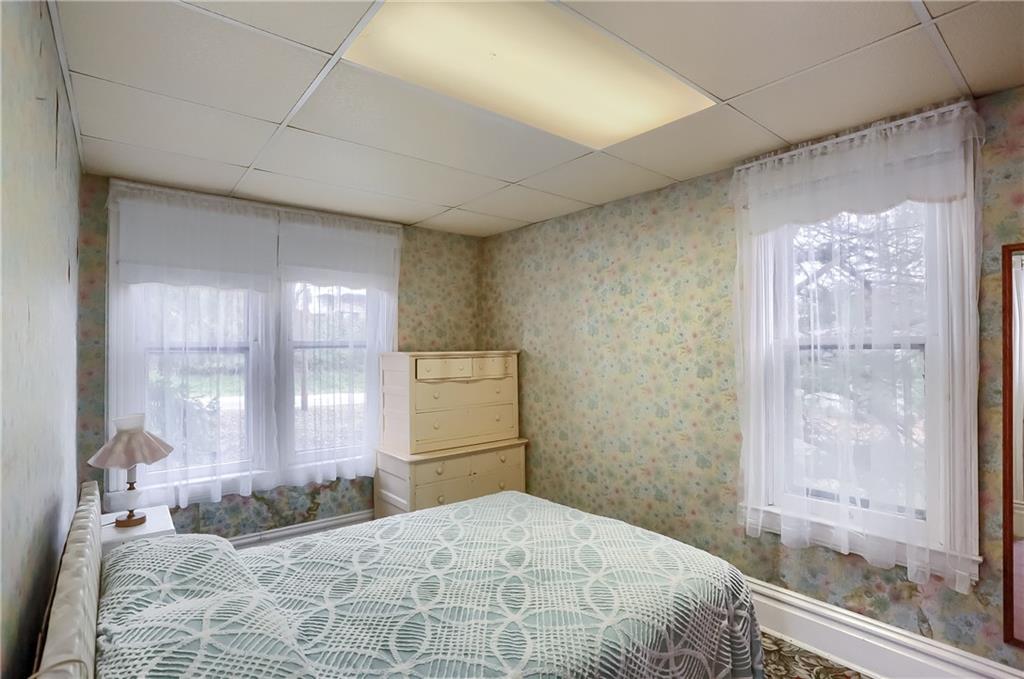 890 Old State Road Apollo, PA 15613 - Photo 19 of 25 a bedroom with a large bed and a large window