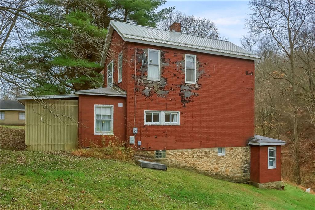 890 Old State Road Apollo, PA 15613 - Photo 4 of 25 front view of a house with a yard