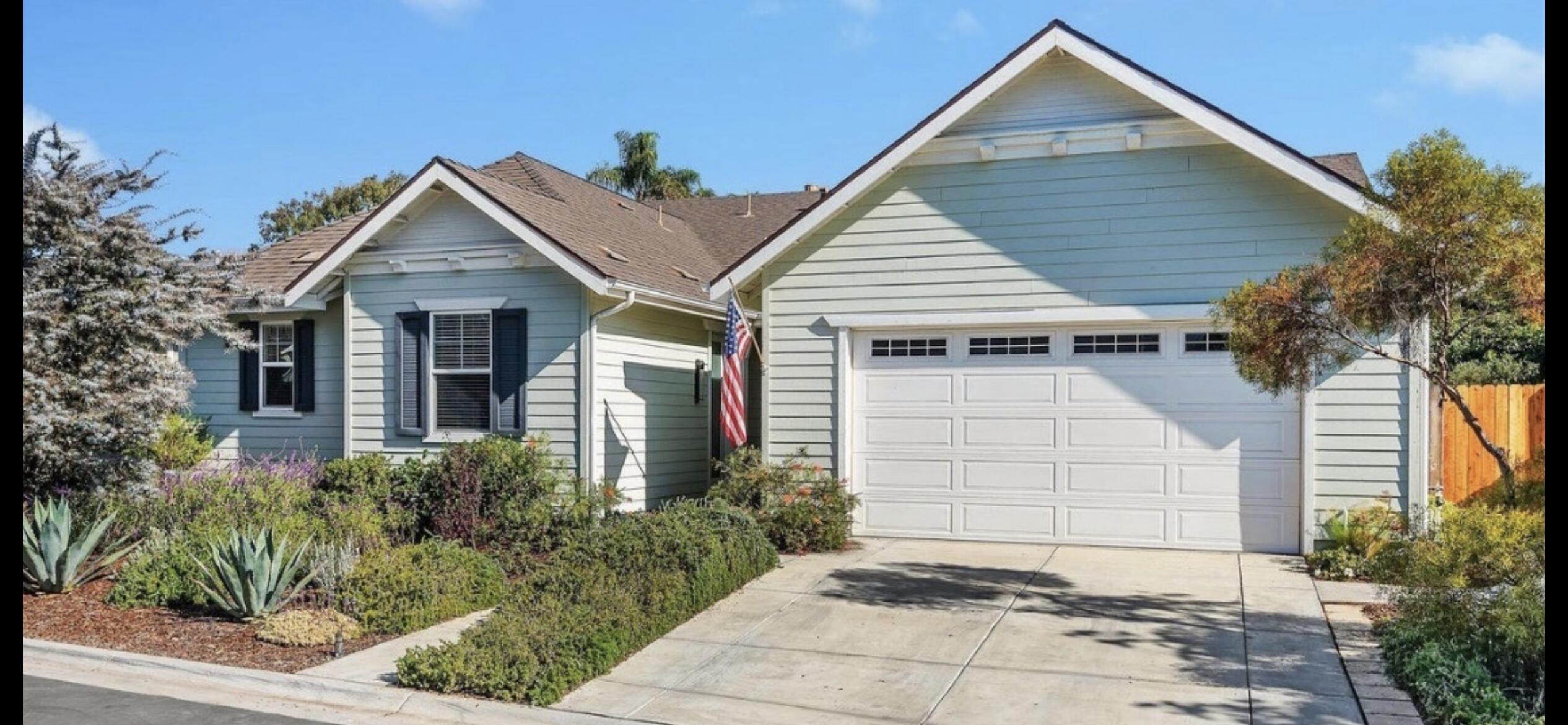 Undisclosed Address Carpinteria, CA 93013 - Photo 1 of 12 a view of a white house next to a yard