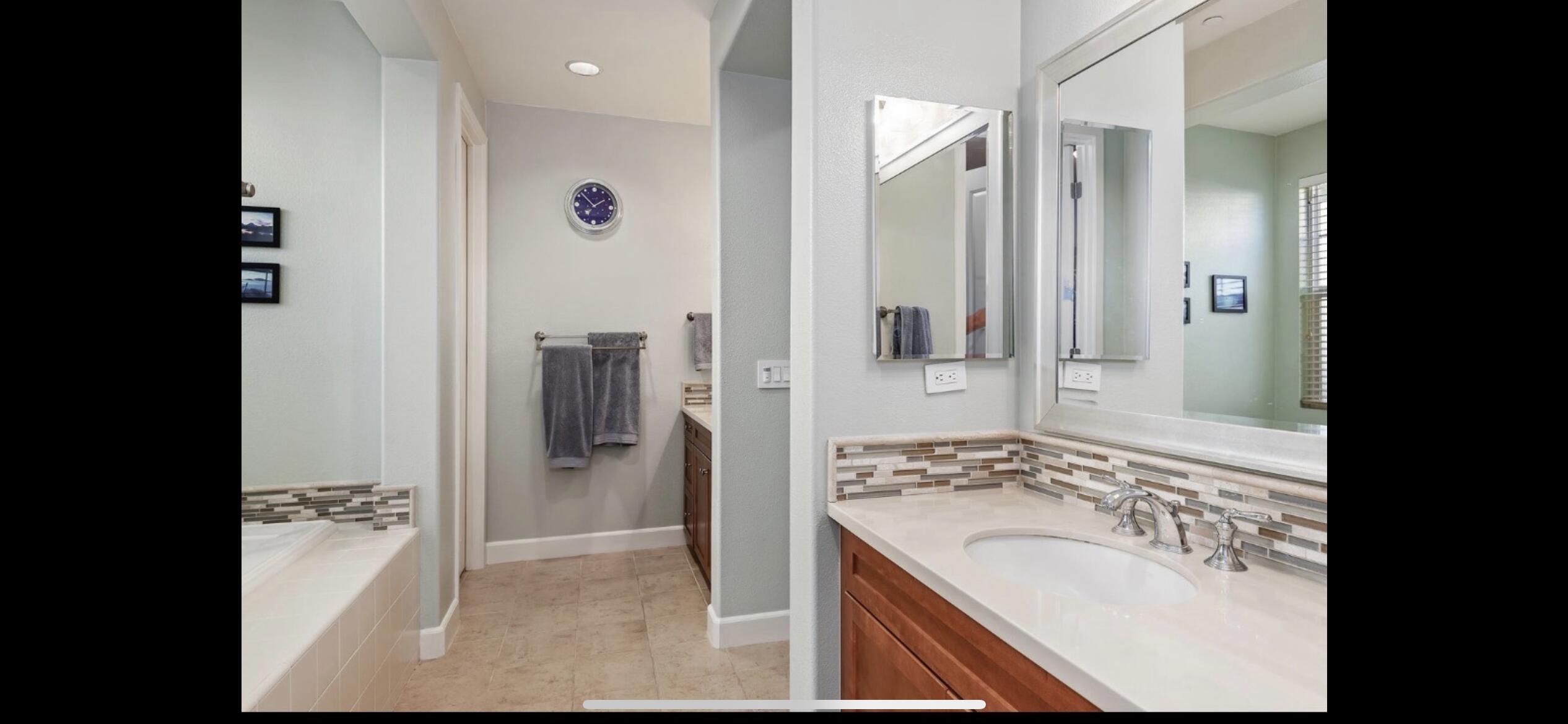 Undisclosed Address Carpinteria, CA 93013 - Photo 7 of 12 a bathroom with a bathtub sink and mirror