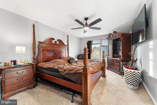 a bed room with a bed and a chandelier