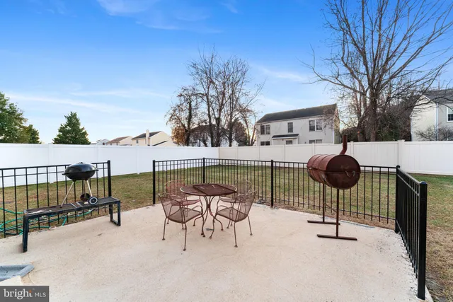 a view of chairs and tables in the patio