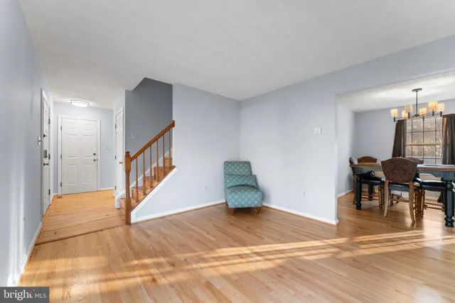 a view of a livingroom with furniture and staircase